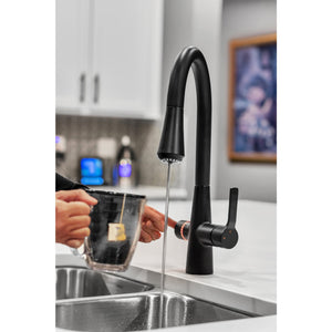 instant hot water faucet in use