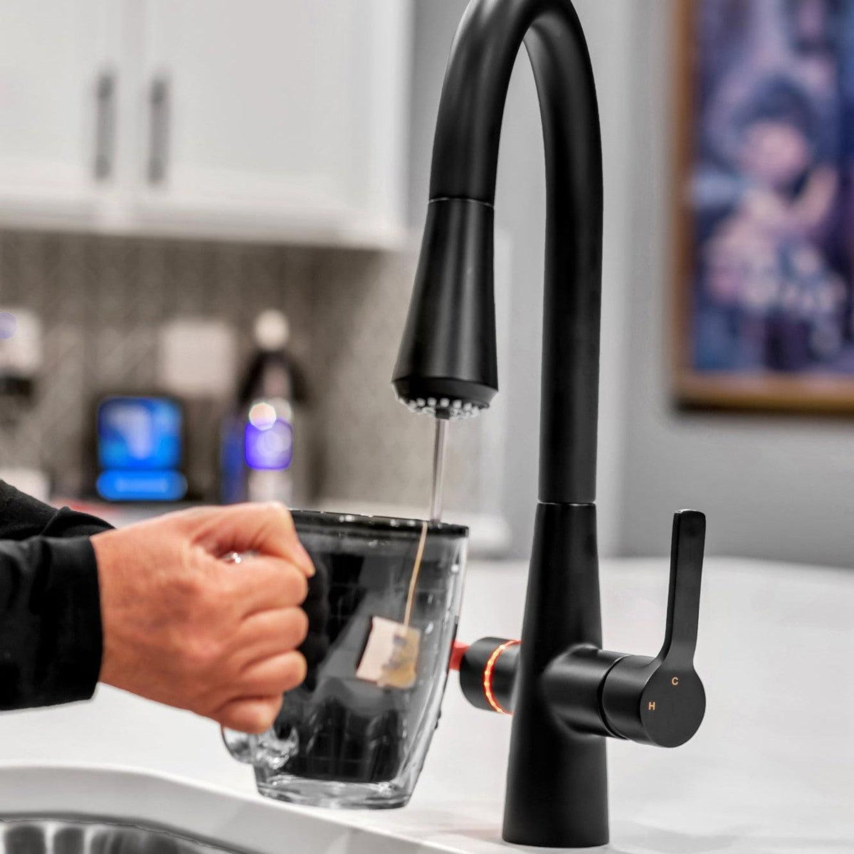 4N1 Instant Hot Water System with Leak Detector black faucet pouring a cup of tea